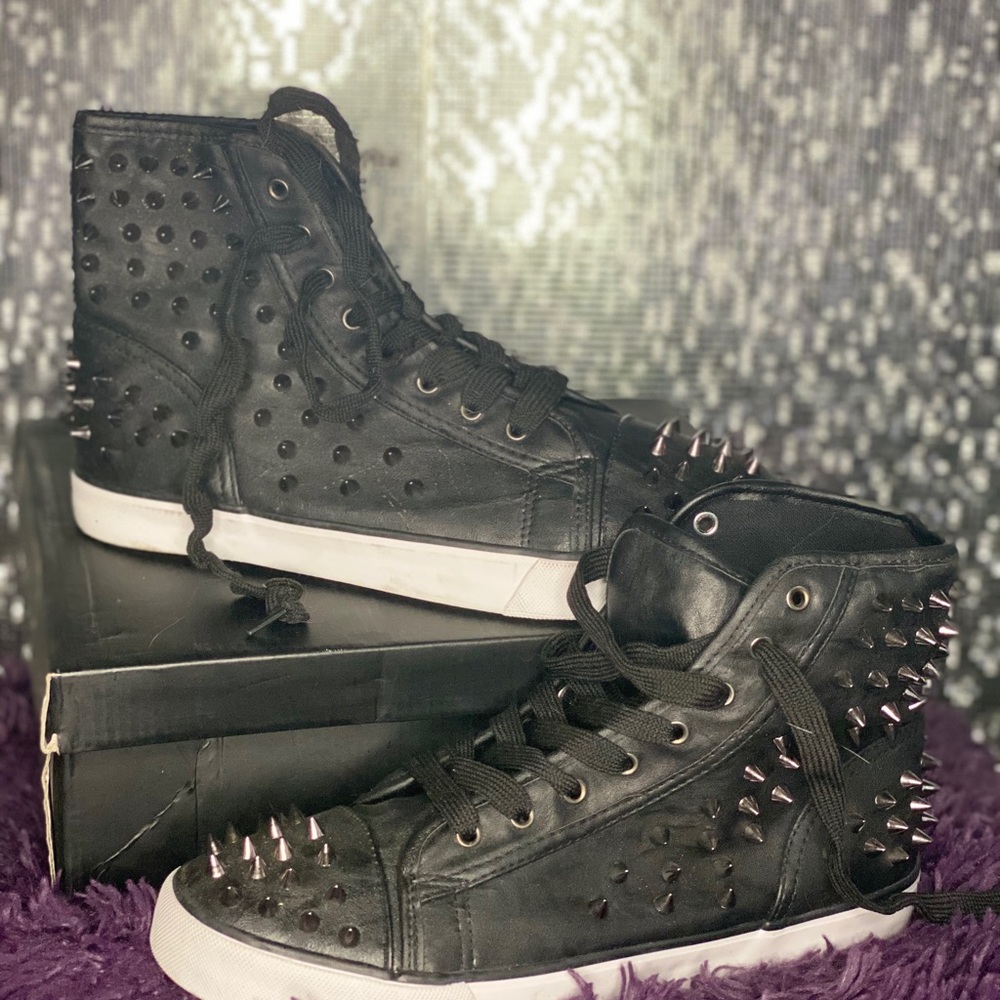 Spiked black high top sneakers